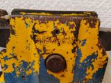 a close up of an old yellow and blue machine