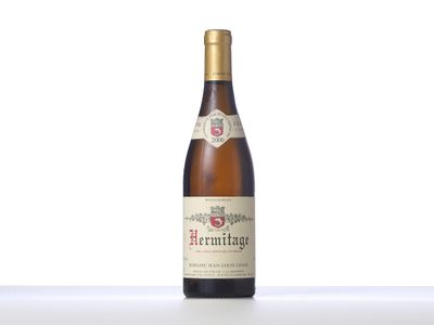an image of a bottle of wine sitting on top of a table