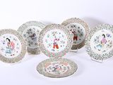 several plates with different designs and designs on them on a white surface