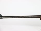 an old rifle with a wooden barrel and a wooden handle