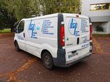 a white van that is parked in a parking lot