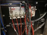 a bunch of wires that are connected to a panel