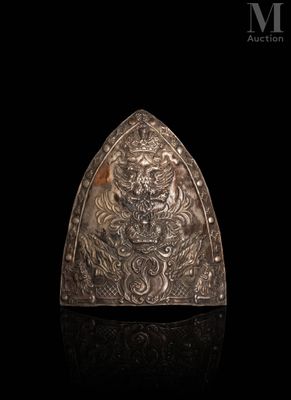 a close up of a metal object on a black surface