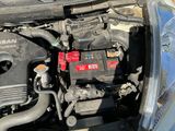 a car engine with a red battery in it