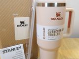 a coffee mug and a straw in front of a cardboard box