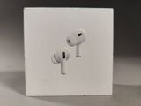 a box with two airpods sitting on top of it