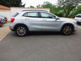 a silver car parked on the side of the road