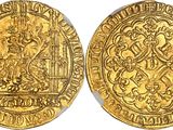 a gold coin with an image of a man on a horse