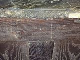 a close up of a wooden table with a marble top