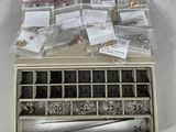 a box of assorted metal items sitting on a table