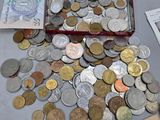 a box full of coins sitting on a table next to a keyboard