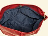 the inside of a red purse with a zipper on it