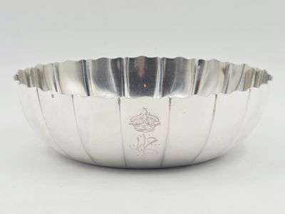 silver plated bowl with a flower design on the side