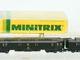 a toy train that is sitting next to a box of cigarettes