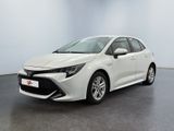 a white toyota corollion parked in a room