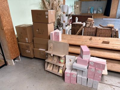 a pile of boxes sitting on the floor next to a pile of boxes