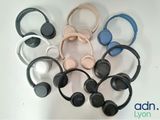 several headphones are arranged in a circle on a white surface