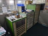a green filing cabinet in a room with a lot of drawers