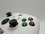 a close up of a game controller with buttons on it