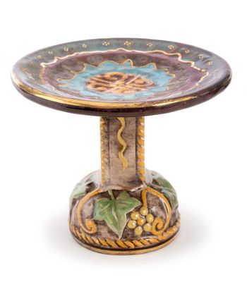 a small decorative table with a flower on it