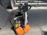 a forklift that is parked in a warehouse