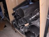 many rolls of black plastic on the floor in a room