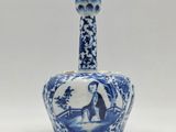 blue and white porcelain bottle with a woman in a landscape