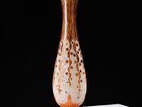 a glass vase that is sitting on a table