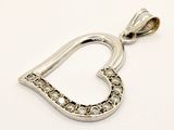 a close up of a heart shaped pendant with diamonds on a white background