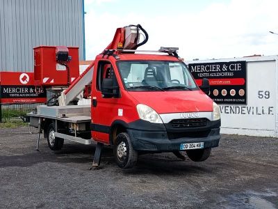 a red truck with a crane on the back of it