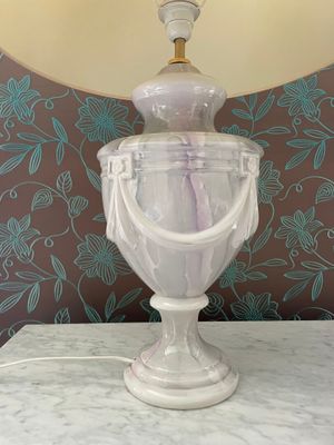 a lamp that is sitting on a table with a lamp on top of it