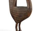 an image of a wooden sculpture of a bird on a white background