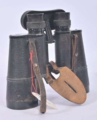 a pair of binoculars that have a tag on them