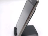 a cell phone that is sitting on top of a stand
