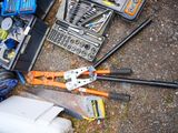 a lot of tools that are laying out on the ground
