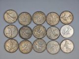 a close up of a bunch of coins sitting on top of a table