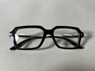 glasses on a table with a white surface and a white background