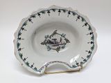 a white plate with a picture of a castle on it