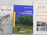 three books are sitting on a table next to each other