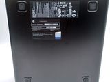 the back of a laptop with a battery on top of it