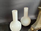 three vases sitting next to each other on a table