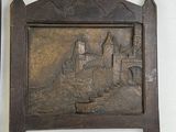 two wooden plaques on the wall of a room