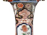 a vase that has a floral design on it