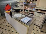 a counter in a store that has a lot of items on it
