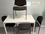 two chairs and a table with a chair on it