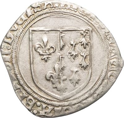 Gros plan sur une pièce de monnaie portant des armoiries