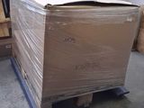 a large box sitting on a pallet in a warehouse