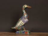 an image of a colorful bird figurine on a table