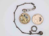 a pocket watch and a chain with a picture on it