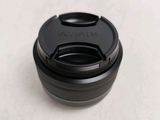 a close up of a camera lens on a white surface